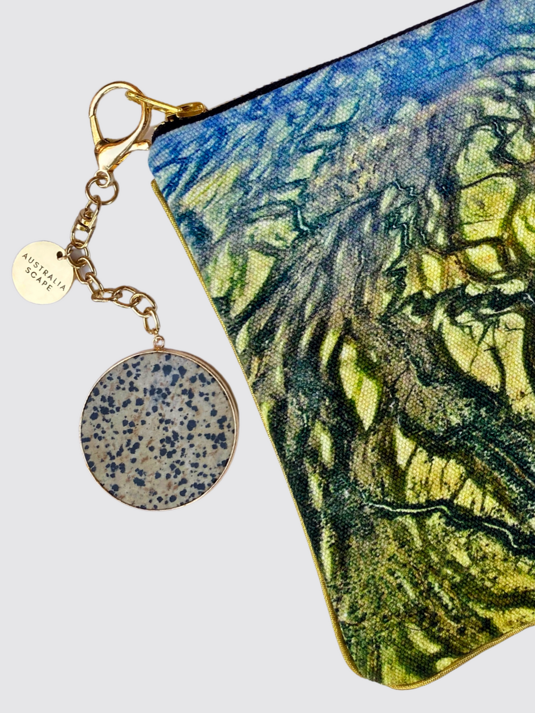 The Diamantina River clutch bag comes with a steel zipper and leopard stone charm.