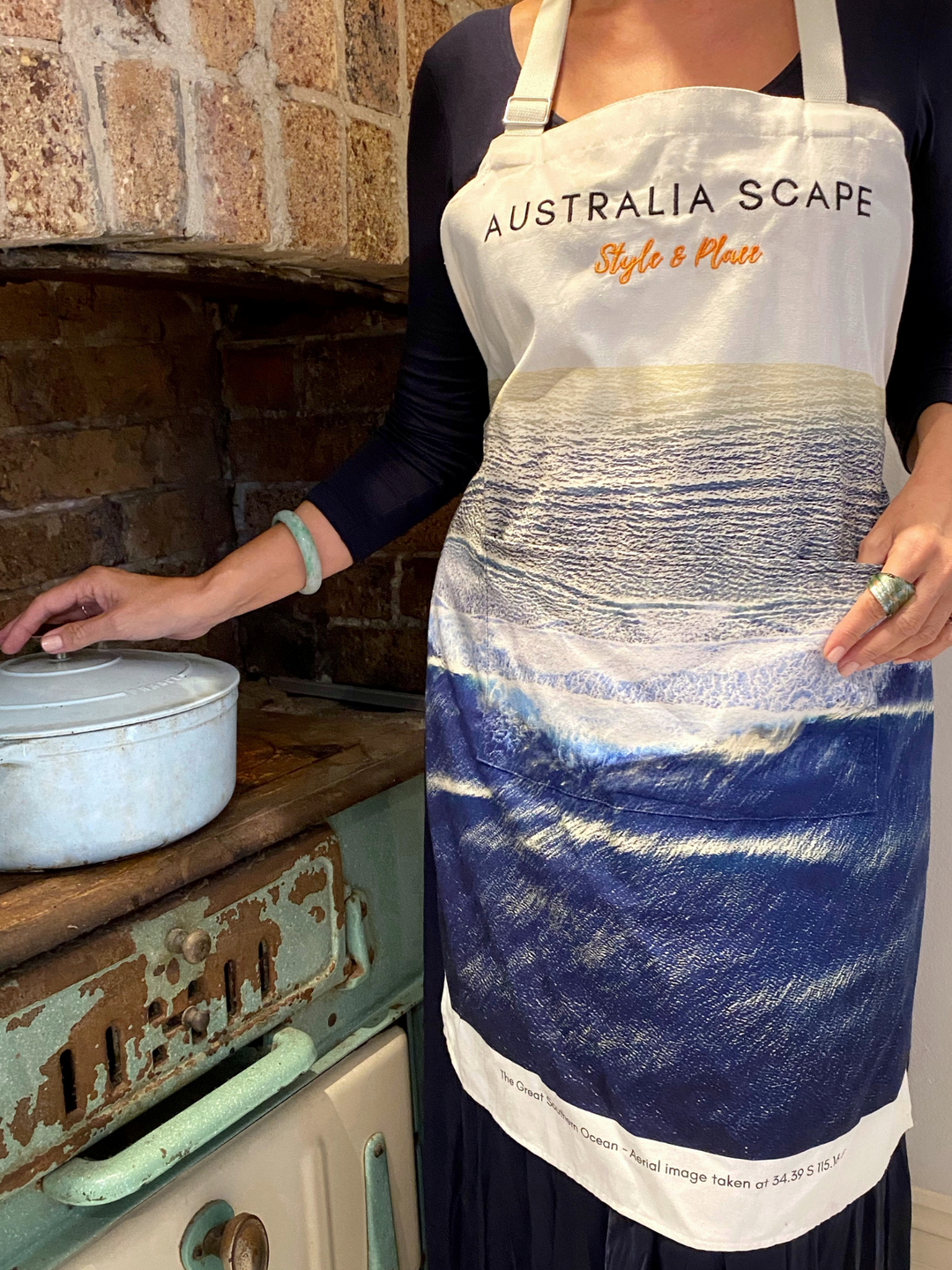 Australia Scape designer cotton canvas apron depicting the Great Southern Ocean in deep indigo and white tones.