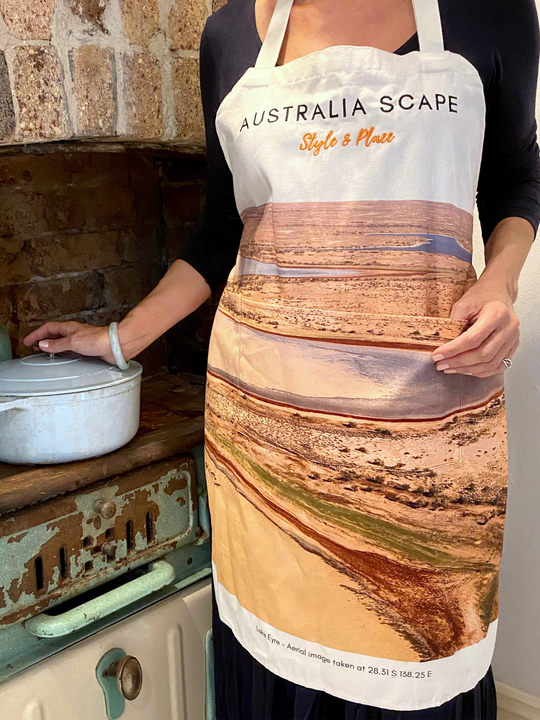 Australia Scape designer cotton canvas apron depicting Lake Eyre in shimmering gold, tan and ochre tones.