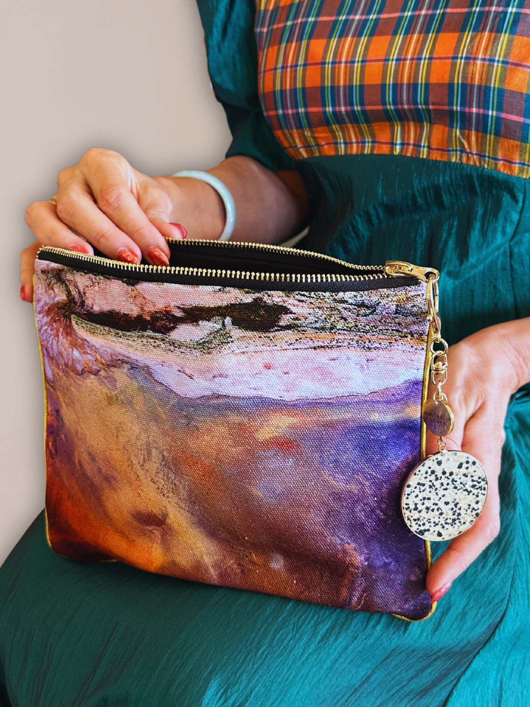 Australia Scape designer cotton canvas clutch bag depicting the Lake Eyre salt pans in orange, gold and pink tones.