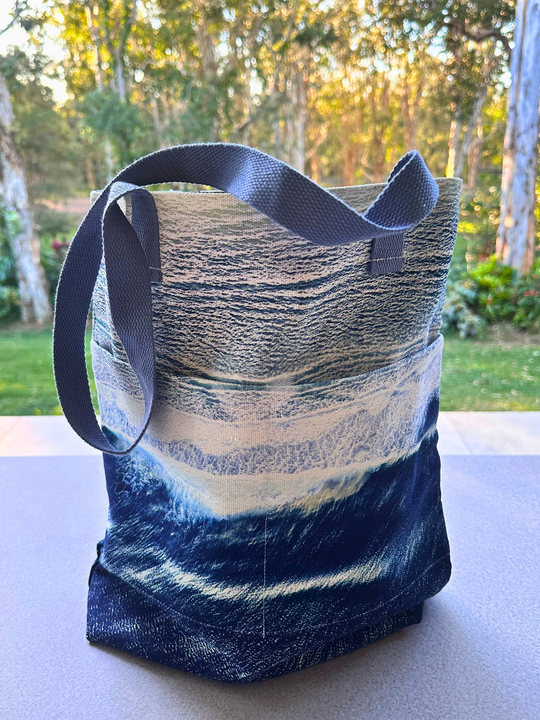 ustralia Scape designer cotton canvas travel tote depicting the Great Southern Ocean in deep indigo and white tones.