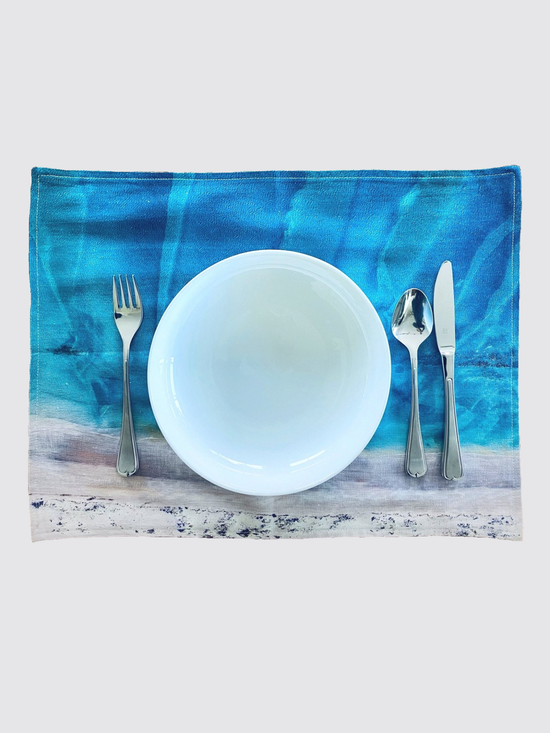 Australia Scape designer cotton-linen placemats depicting Cape Leveque in turquoise and white tones.