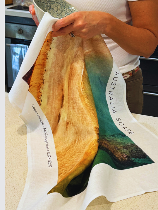 Australia Scape designer tea towel in 100% linen depicting Cape Leveque in golden and aquamarine tones.