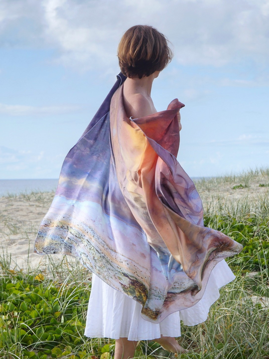 Australia Scape designer scarf in 100% silk depicting the Lake Eyre landscape in pink and gold tones.